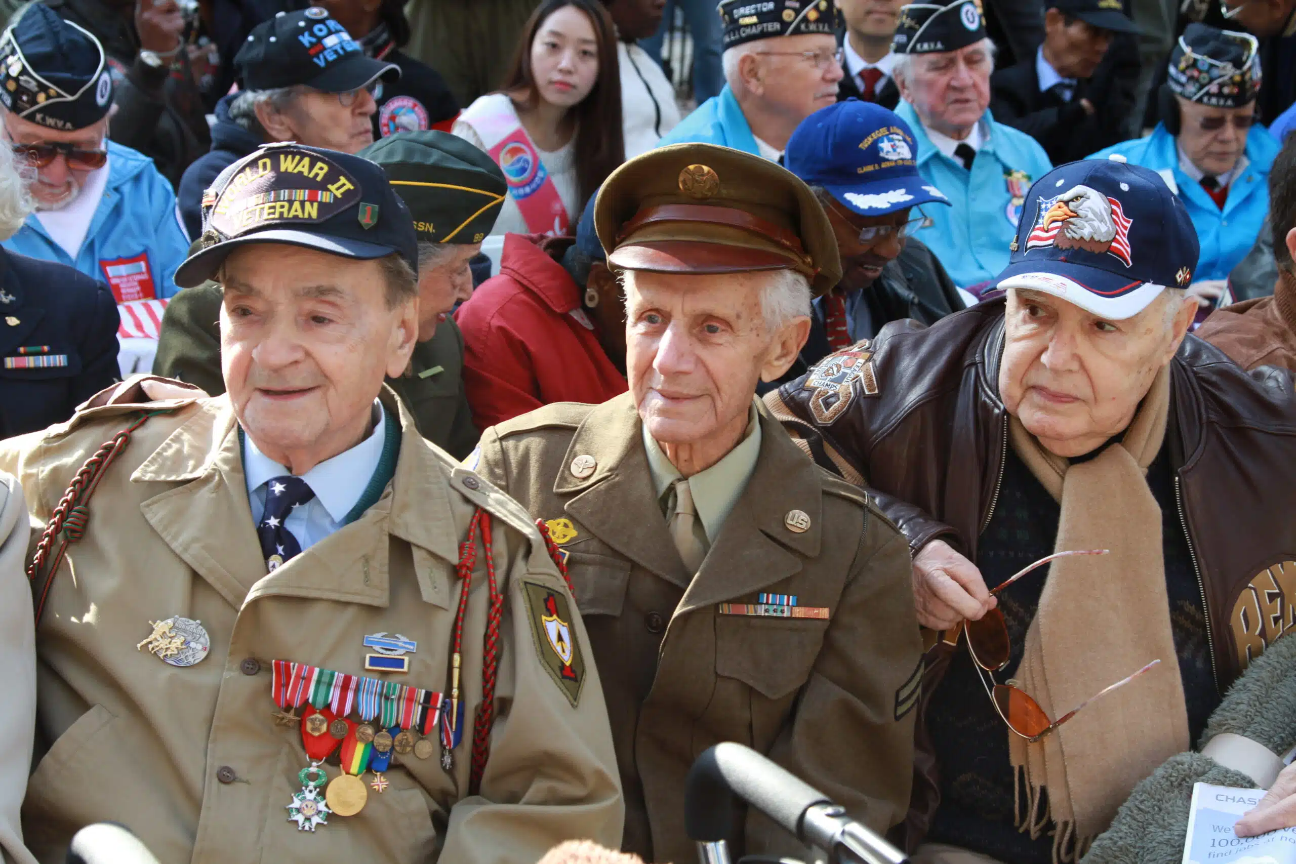 A group of men in military uniforms standing next to each other.